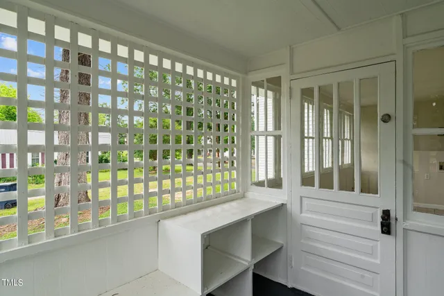 a view of a livingroom with wooden floor and window
