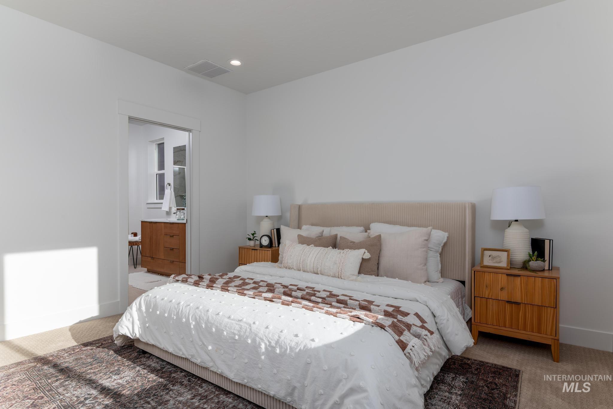 1689 West Paloma Rdg Street Kuna, ID 83634 - Photo 7 of 11 Bedroom featuring light carpet, recessed lighting, and ensuite bathroom