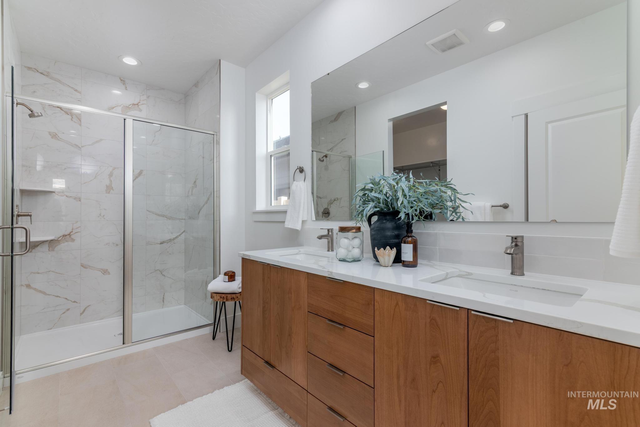 1689 West Paloma Rdg Street Kuna, ID 83634 - Photo 8 of 11 Full bathroom featuring double vanity, a marble finish shower, and recessed lighting