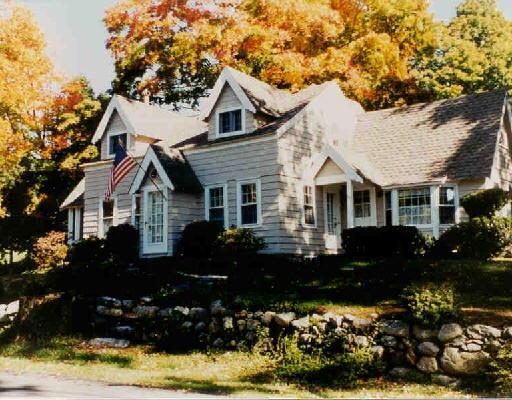 154 North Street Ridgefield, CT 06877 - Photo 1 of 1 a front view of a house with a yard