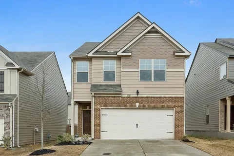 a view of a house with garage