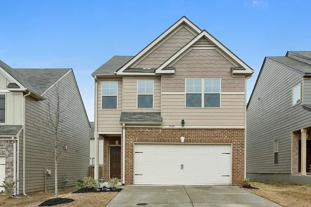 a view of a house with garage