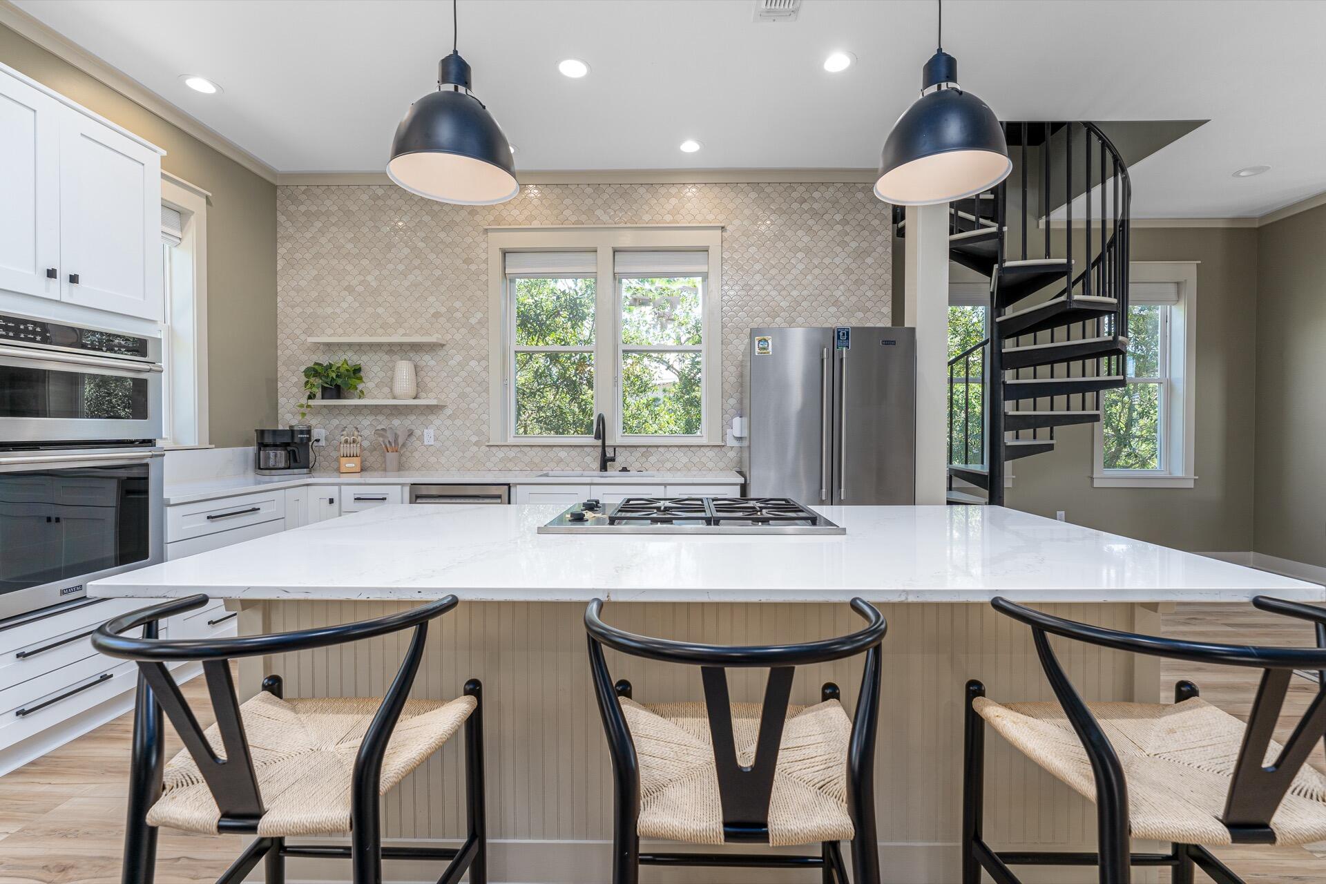 186 Old Beach Road Santa Rosa Beach, FL 32459 - Photo 8 of 21 a kitchen with a table and chairs in it