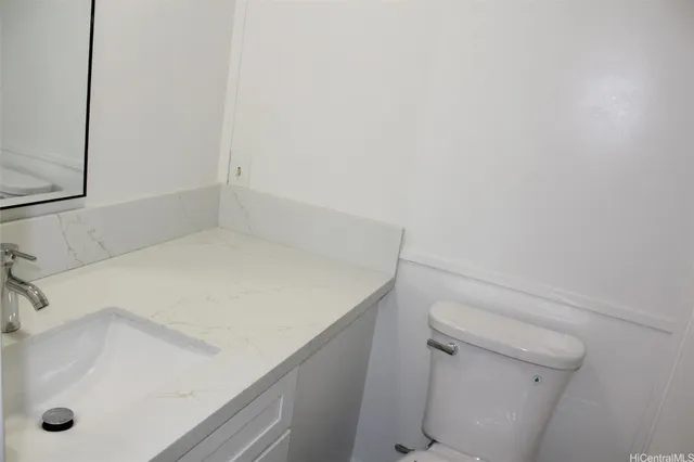 a bathroom with a sink and toilet