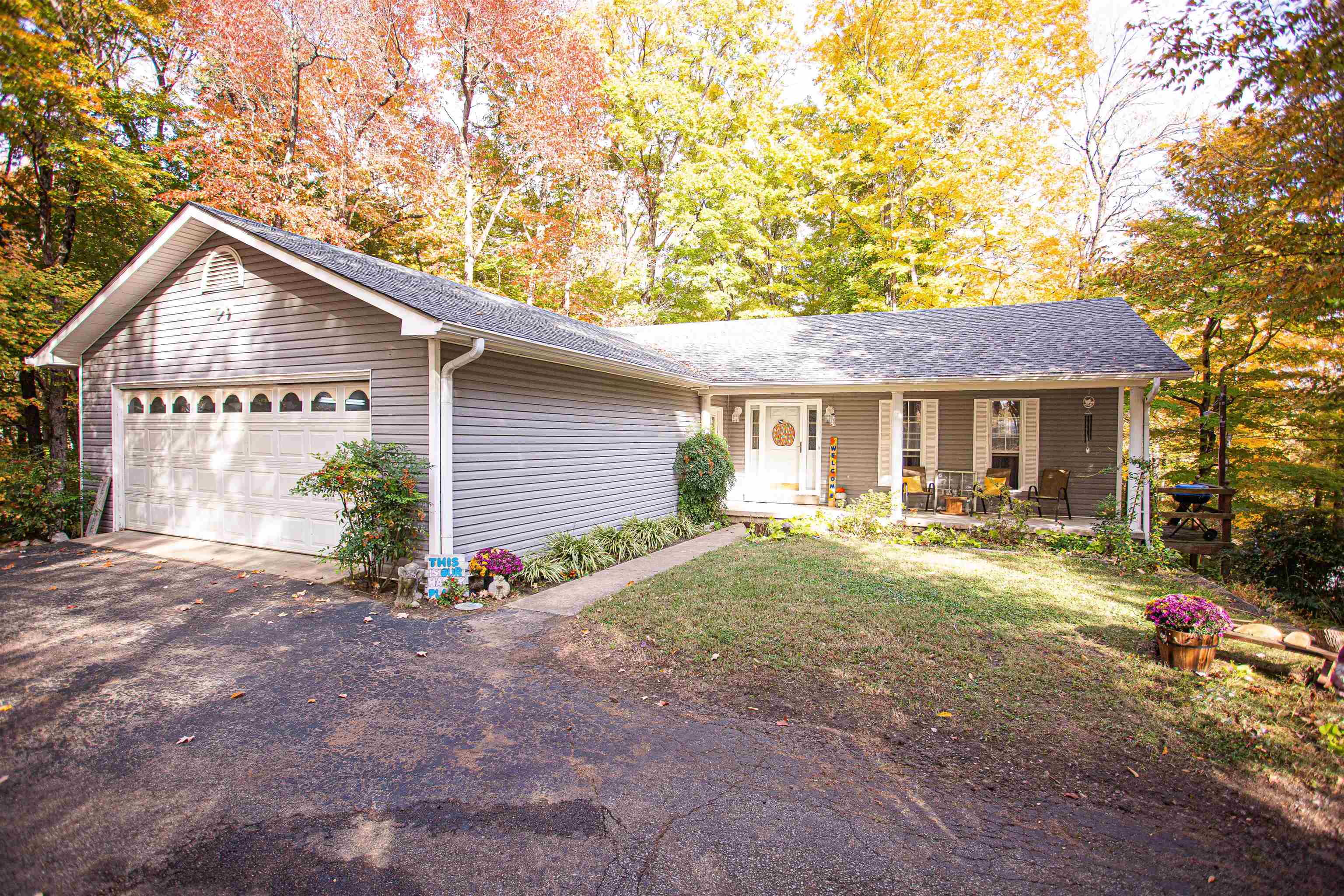 90 Aubrey Lane Ripley, TN 38063 - Photo 1 of 25 a front view of a house with a yard and porch