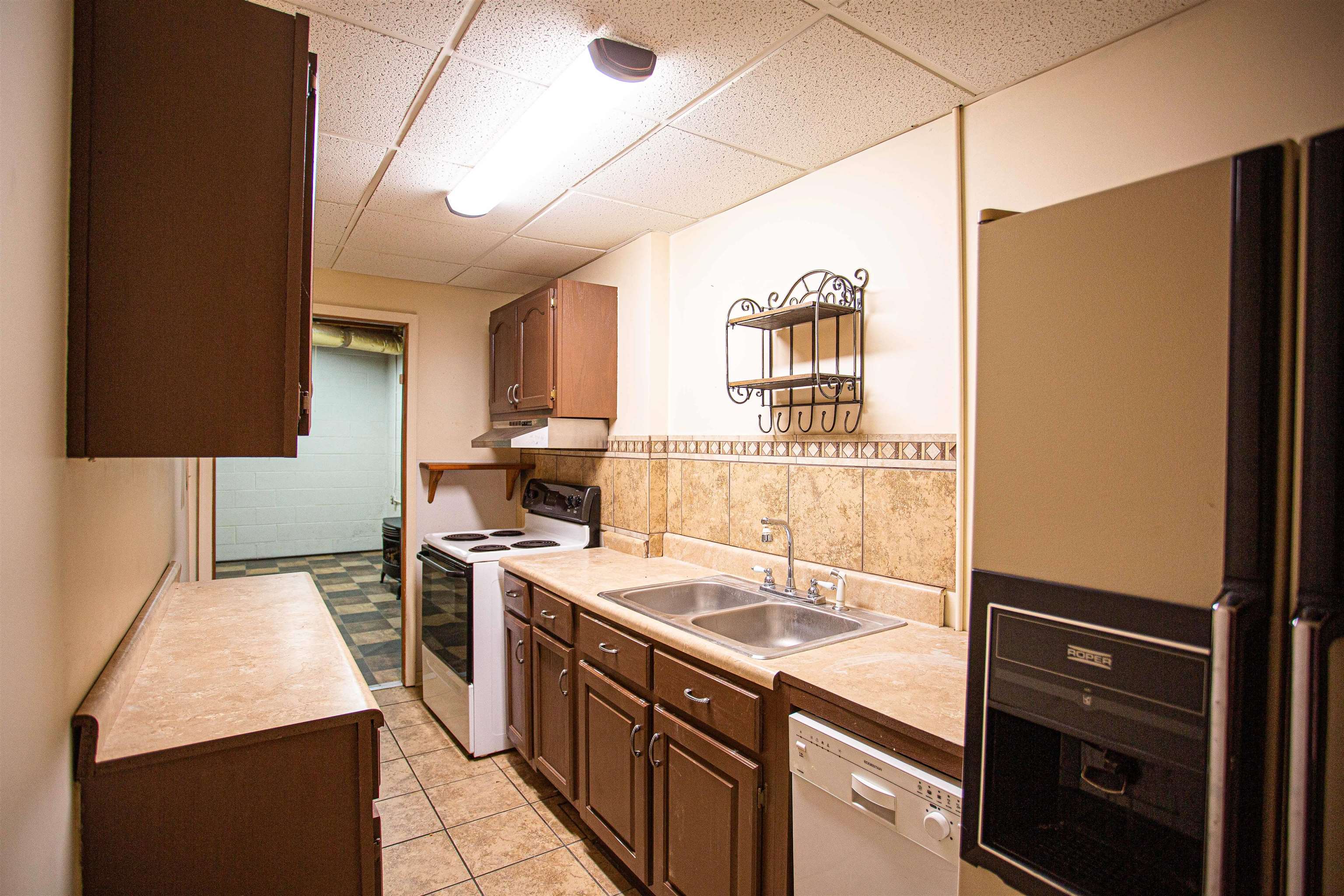 90 Aubrey Lane Ripley, TN 38063 - Photo 16 of 25 a kitchen that has a sink stainless steel appliances counter space and a window