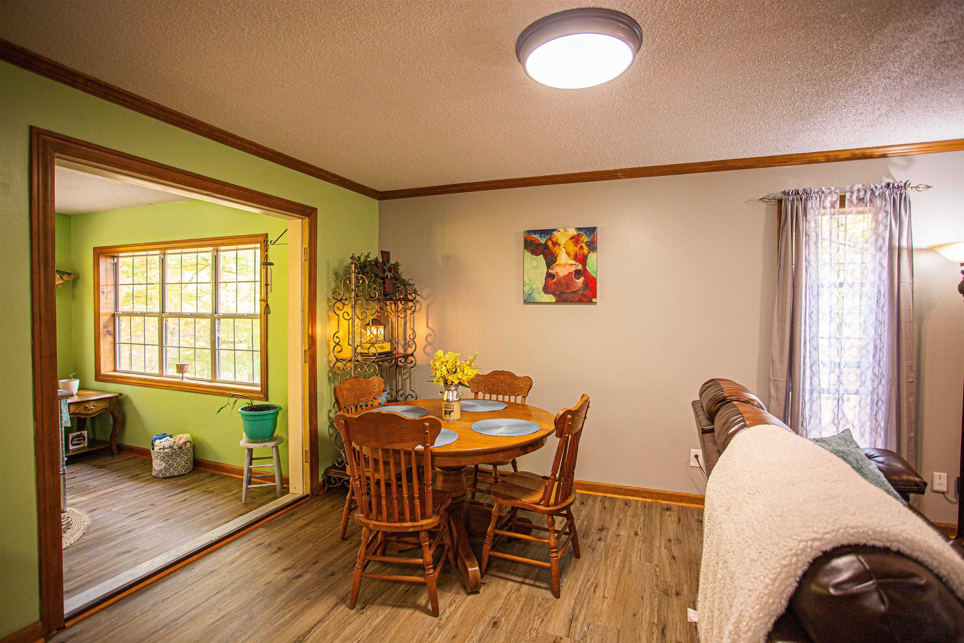 90 Aubrey Lane Ripley, TN 38063 - Photo 6 of 25 a view of a dining room with furniture and wooden floor