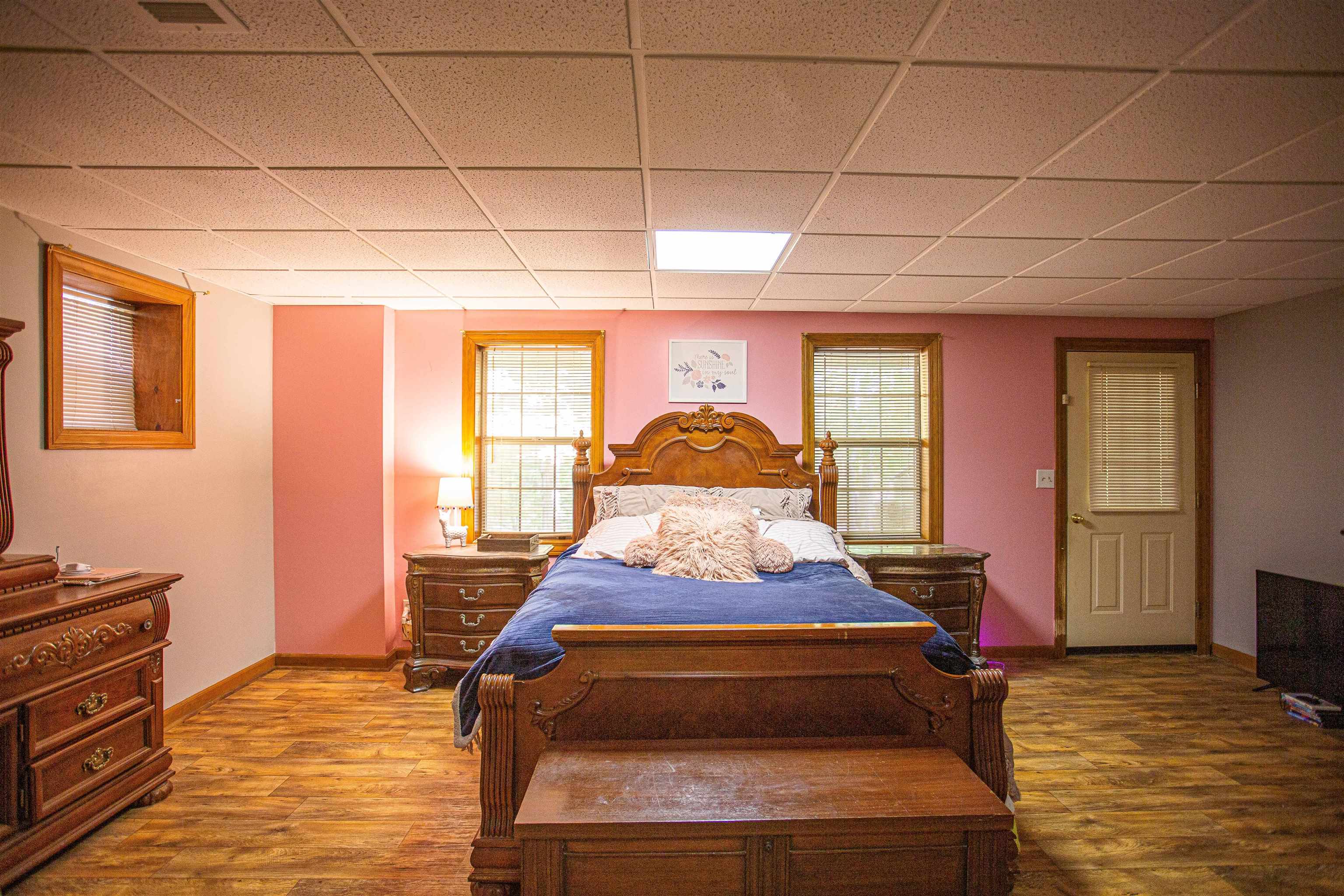 90 Aubrey Lane Ripley, TN 38063 - Photo 10 of 25 a bedroom with a bed and wooden floor