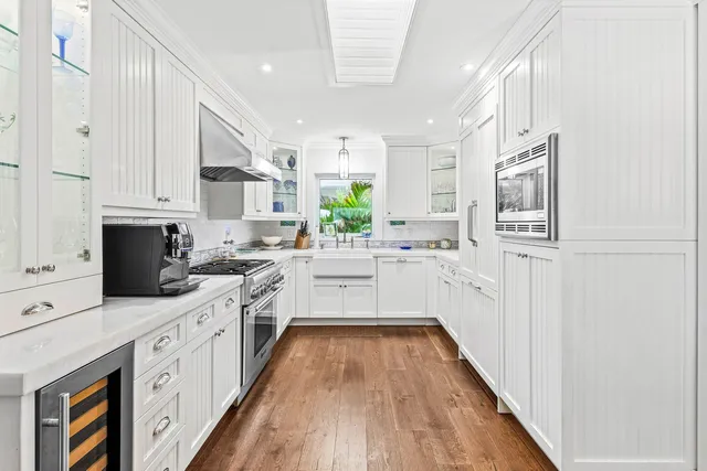 a kitchen with cabinets oven and a dishwasher
