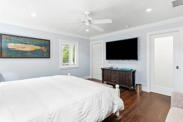 a bed room with a bed and a chandelier