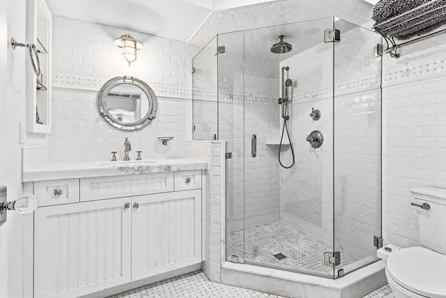 a spacious bedroom with a bed and wooden floor