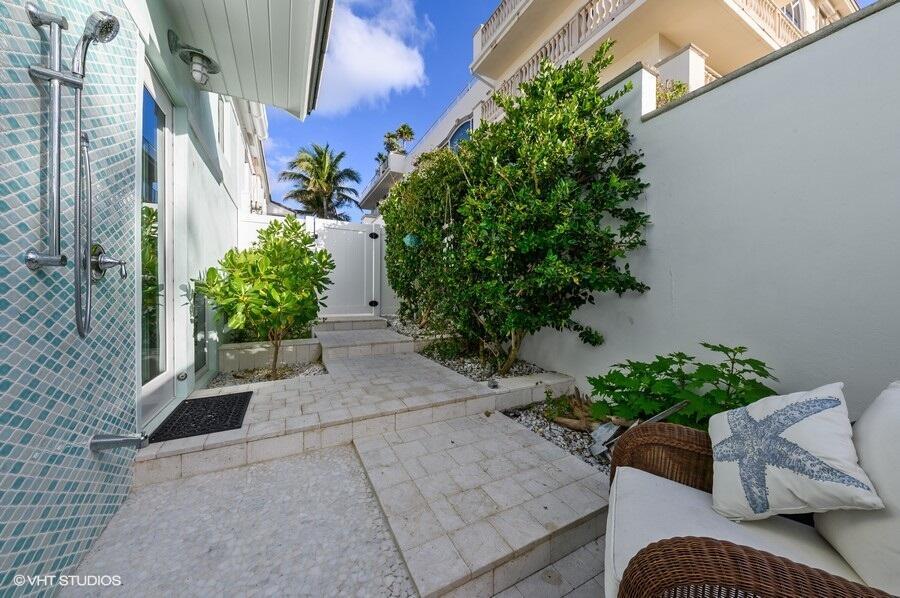 3421 South Ocean Boulevard, Unit 1 Highland Beach, FL 33487 - Photo 25 of 42 a outdoor living space with furniture and flowers