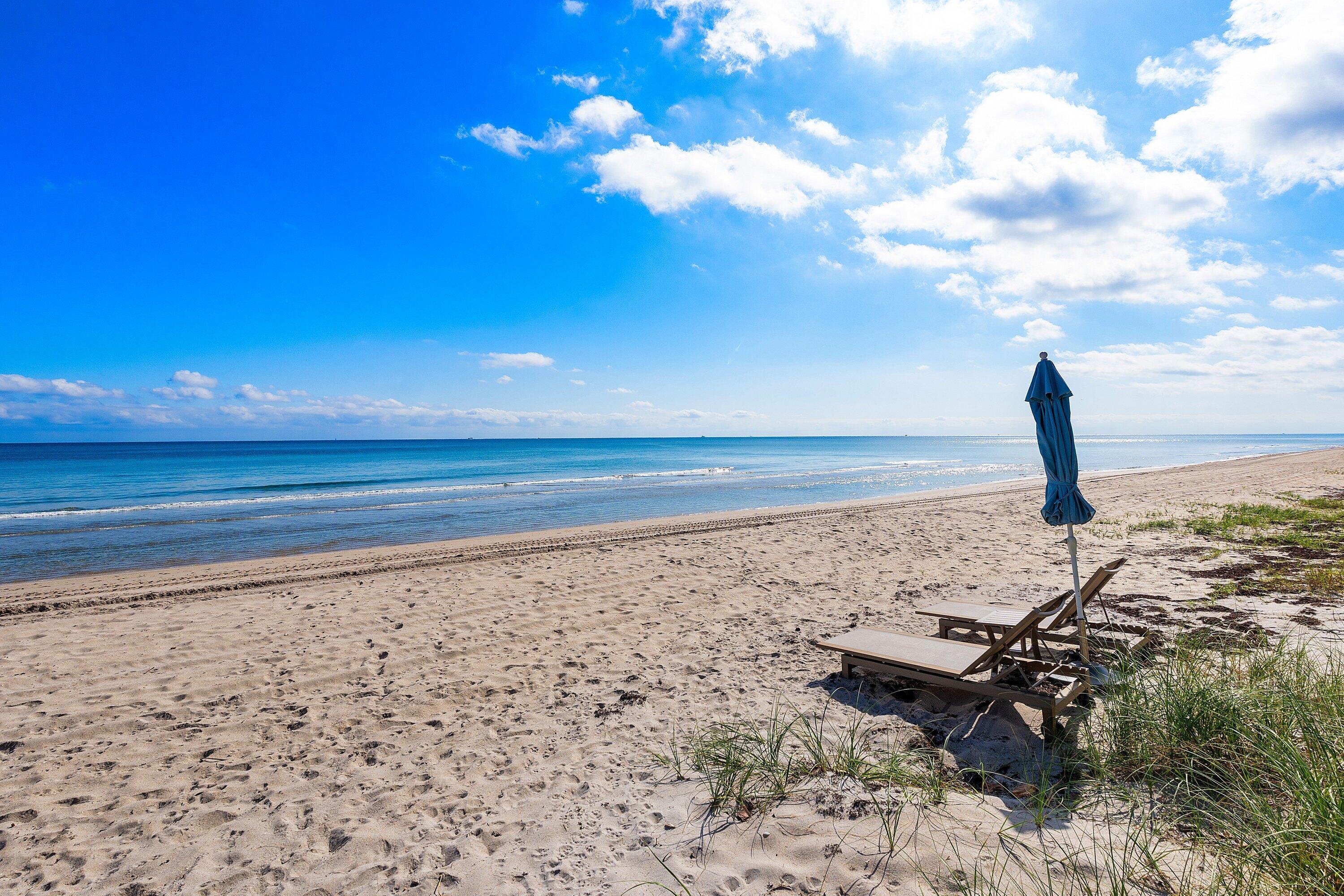 3421 South Ocean Boulevard, Unit 1 Highland Beach, FL 33487 - Photo 33 of 42 a view of a lake with a beach