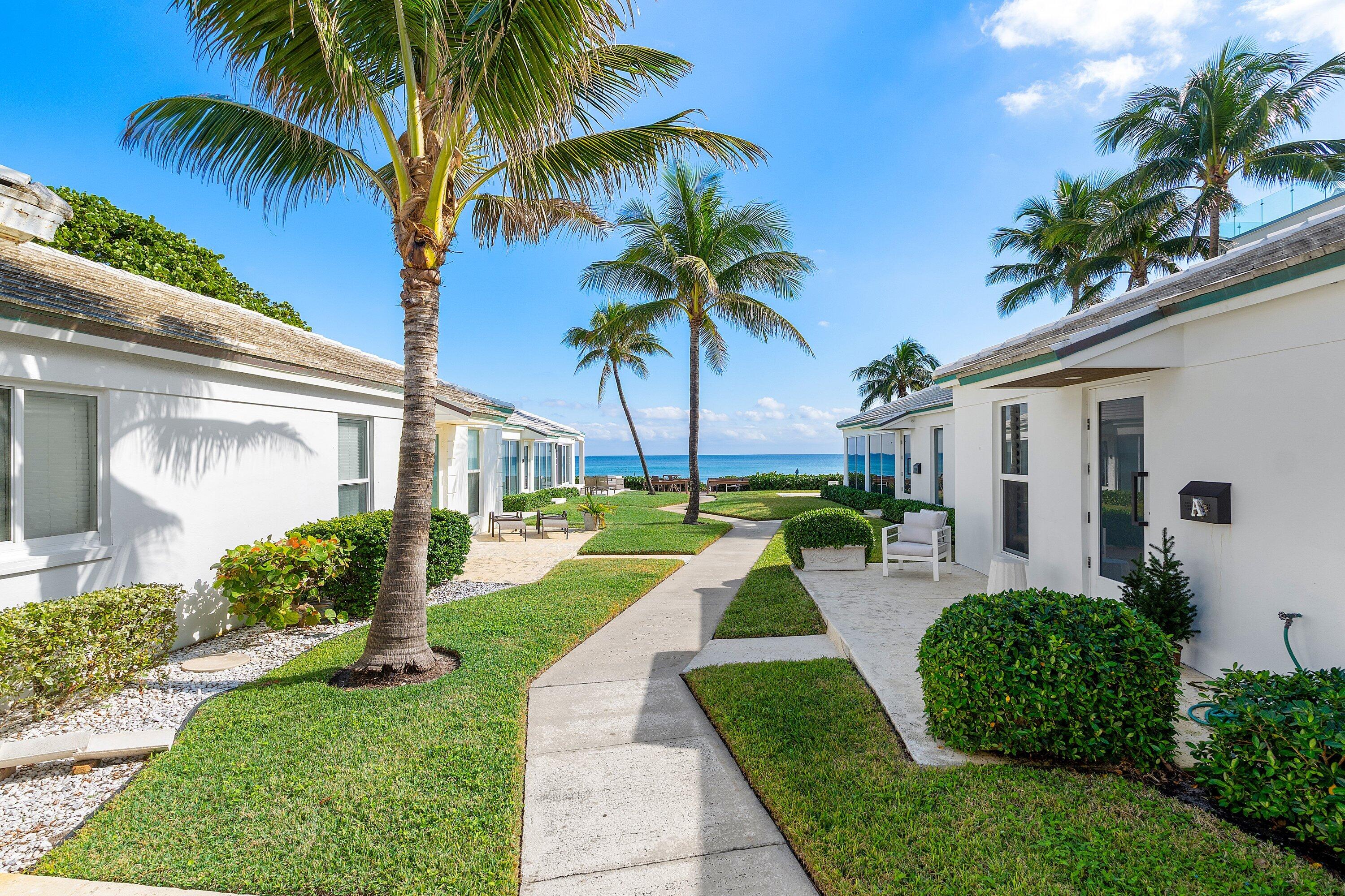 3421 South Ocean Boulevard, Unit 1 Highland Beach, FL 33487 - Photo 34 of 42 a house with palm tree in front of it