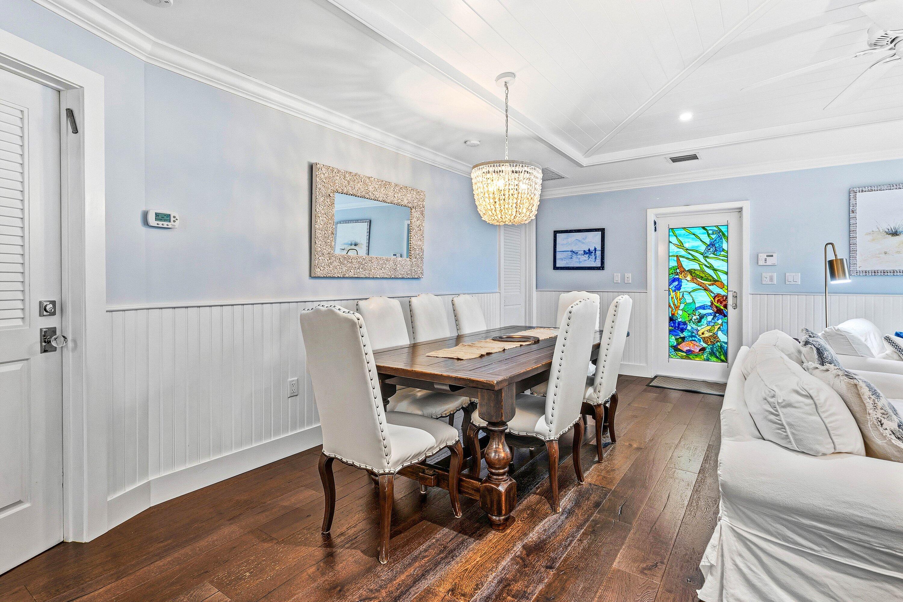 3421 South Ocean Boulevard, Unit 1 Highland Beach, FL 33487 - Photo 5 of 42 a view of a dining room with furniture and wooden floor