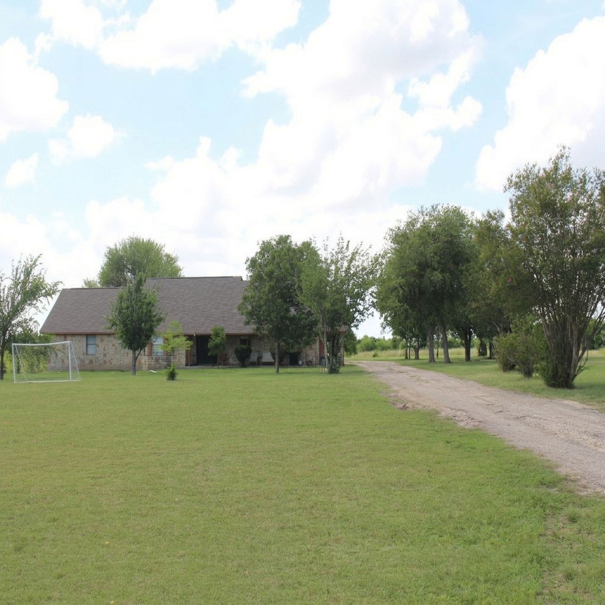 14520 Bois-D-Arc Road Manor, TX 78653 - Photo 1 of 1 A long private drive leads to this charming ranch-style stone residence, nestled amidst mature trees.
