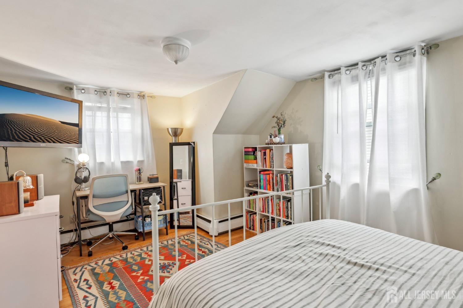 153 East Hill Road Colonia, NJ 07067 - Photo 13 of 40 a bedroom with furniture and a book shelf