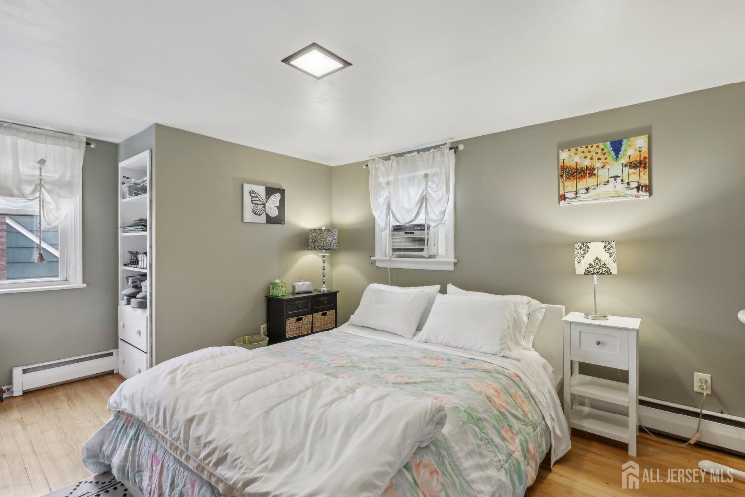 153 East Hill Road Colonia, NJ 07067 - Photo 15 of 40 a bedroom with a bed and a window