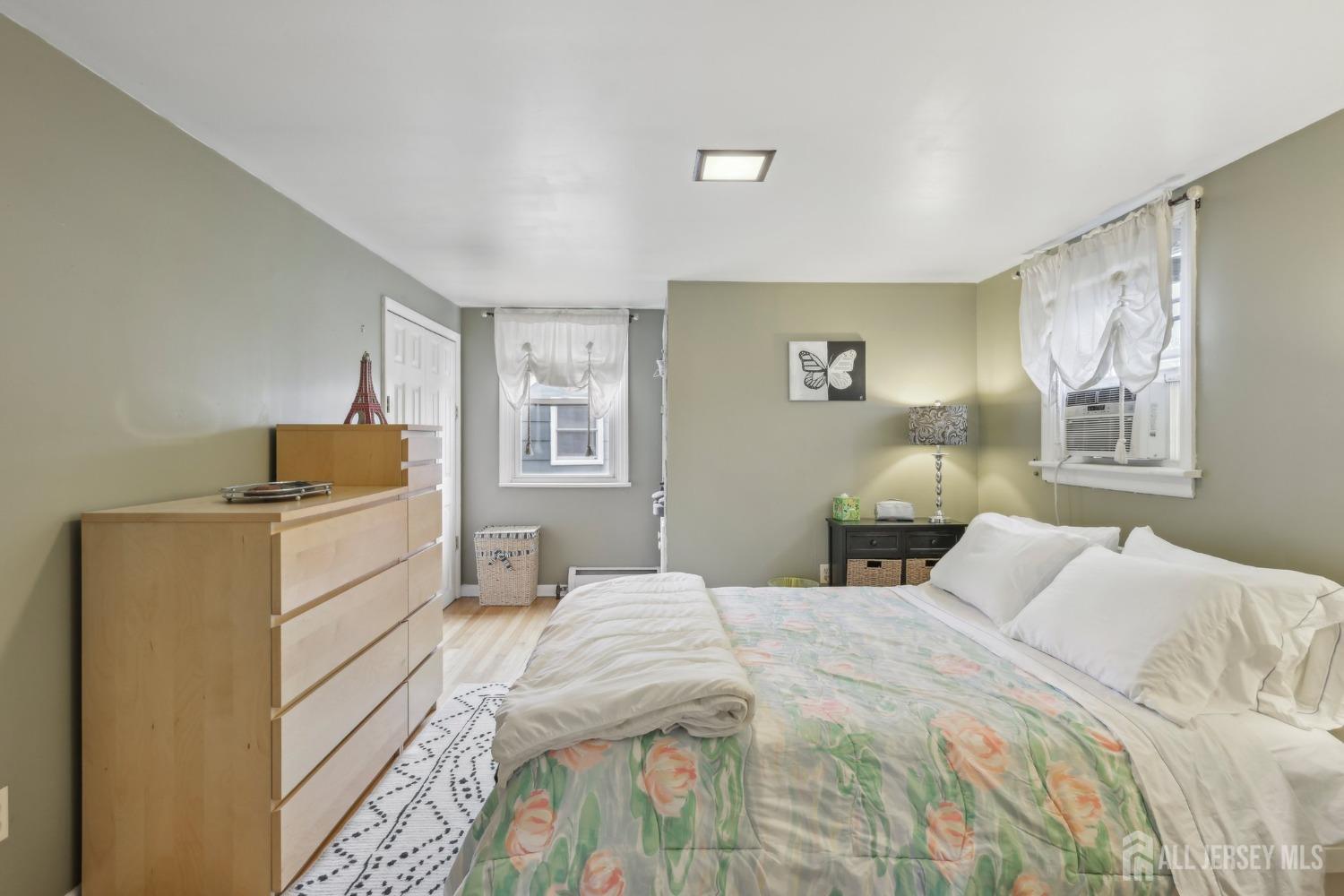 153 East Hill Road Colonia, NJ 07067 - Photo 18 of 40 a bedroom with a bed and a dresser