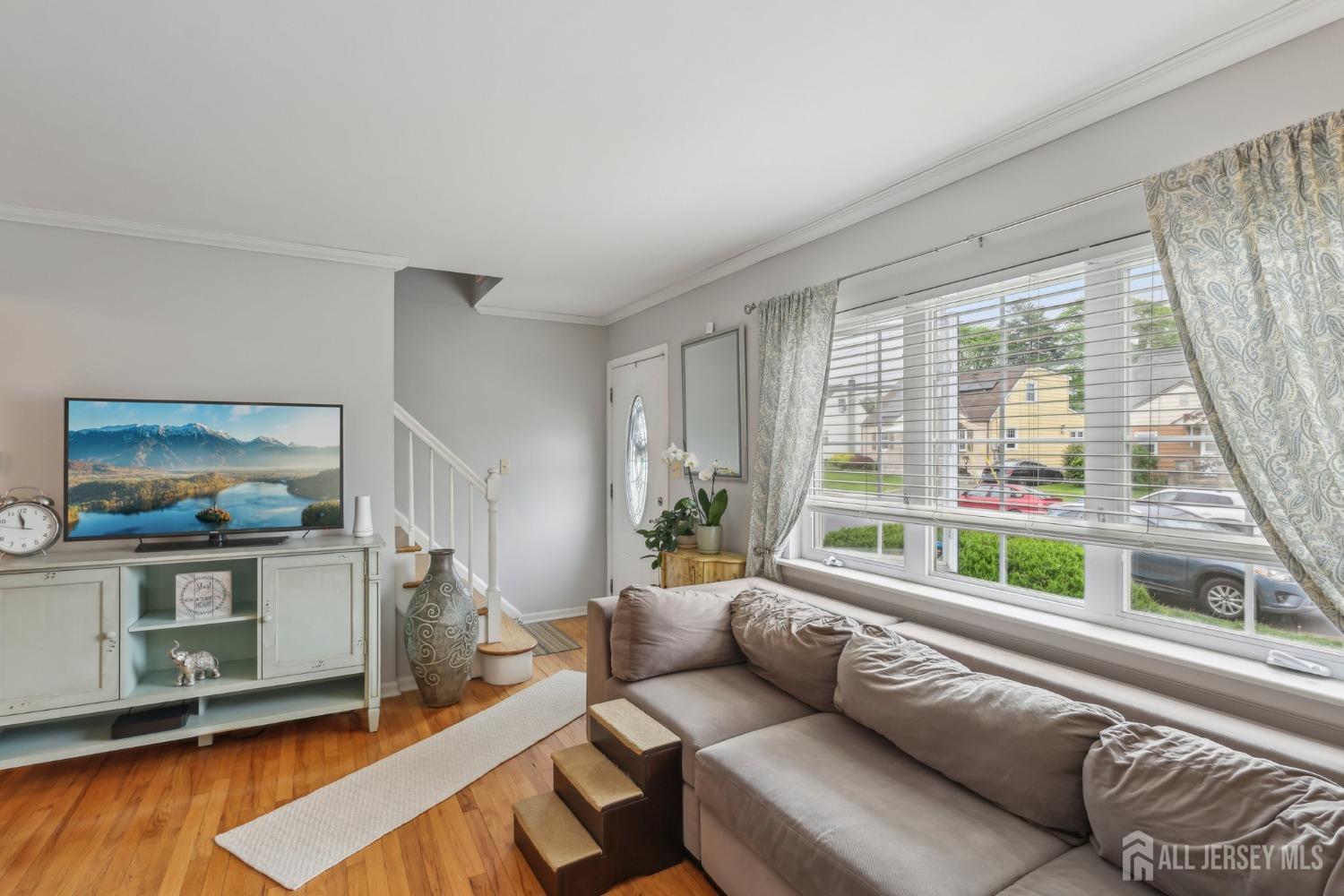 153 East Hill Road Colonia, NJ 07067 - Photo 2 of 40 a living room with furniture and large window
