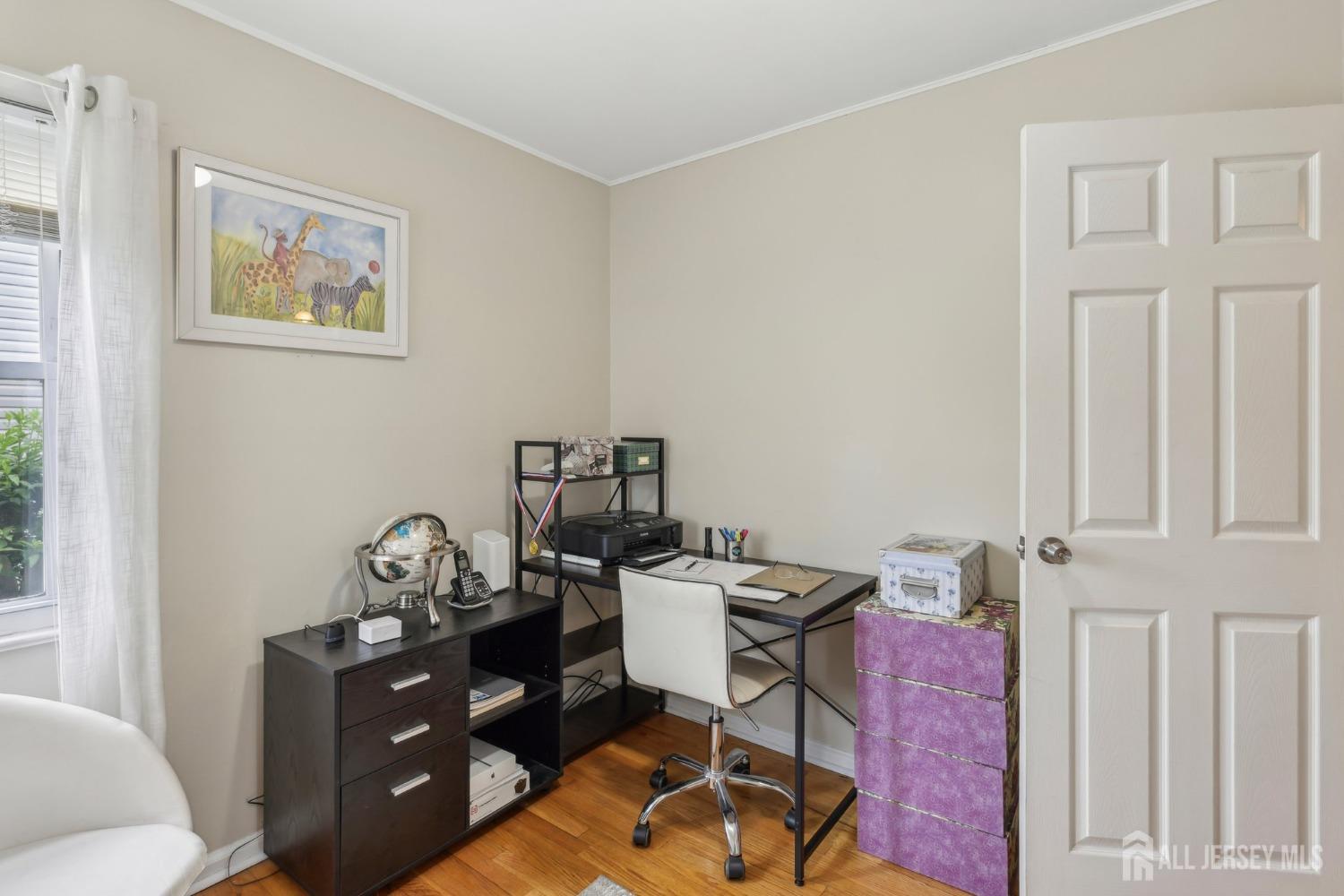 153 East Hill Road Colonia, NJ 07067 - Photo 21 of 40 a view of a workspace with furniture and a window