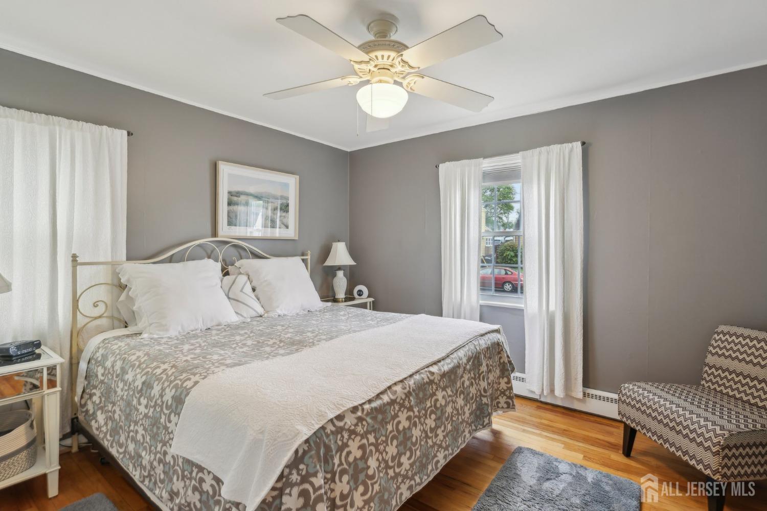 153 East Hill Road Colonia, NJ 07067 - Photo 22 of 40 a bedroom with a bed and a chandelier