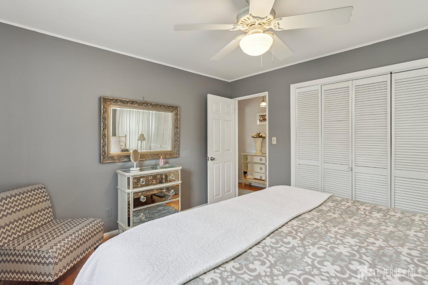 153 East Hill Road Colonia, NJ 07067 - Photo 23 of 40 a bedroom with a bed and a chandelier