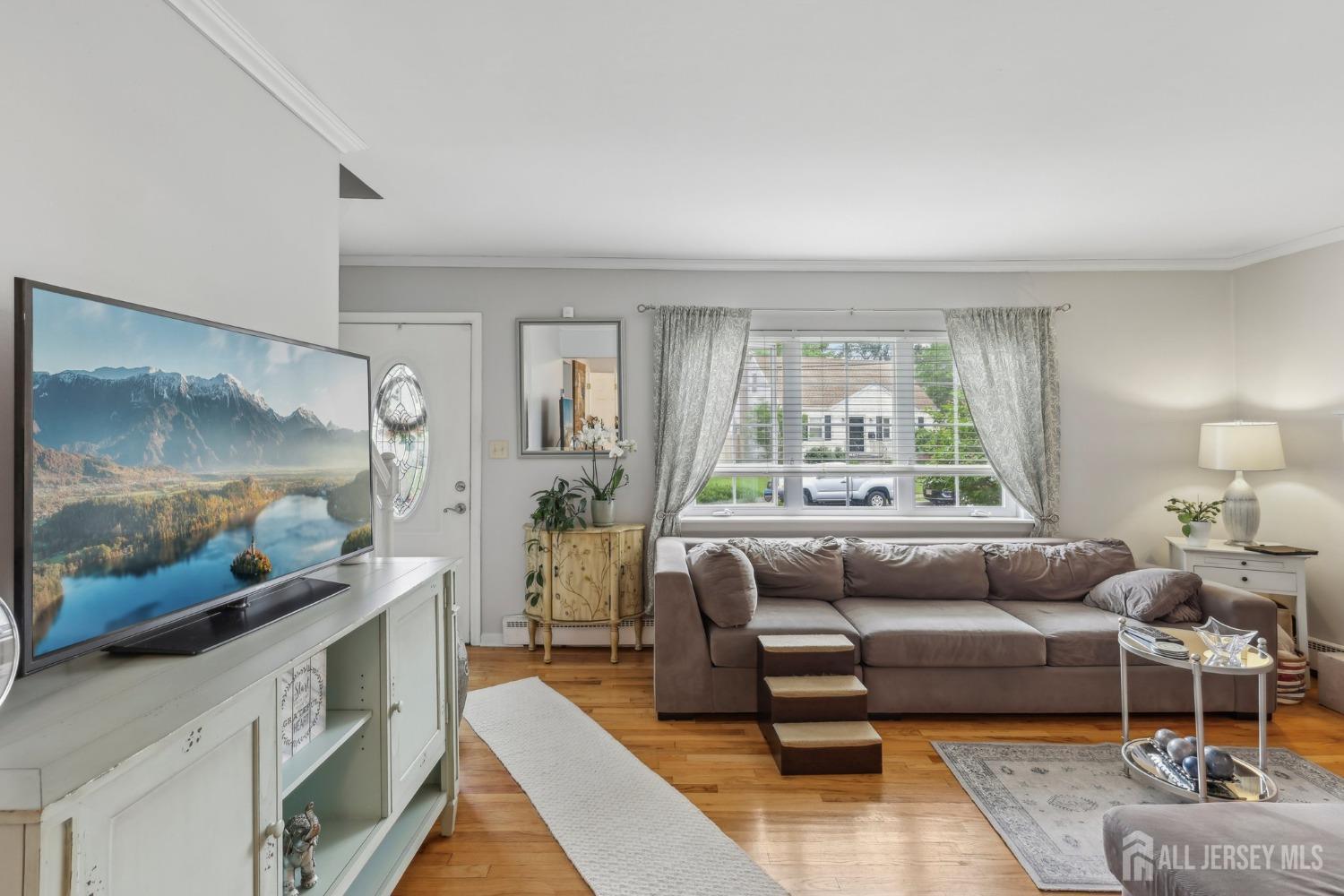 153 East Hill Road Colonia, NJ 07067 - Photo 3 of 40 a living room with furniture and a large window