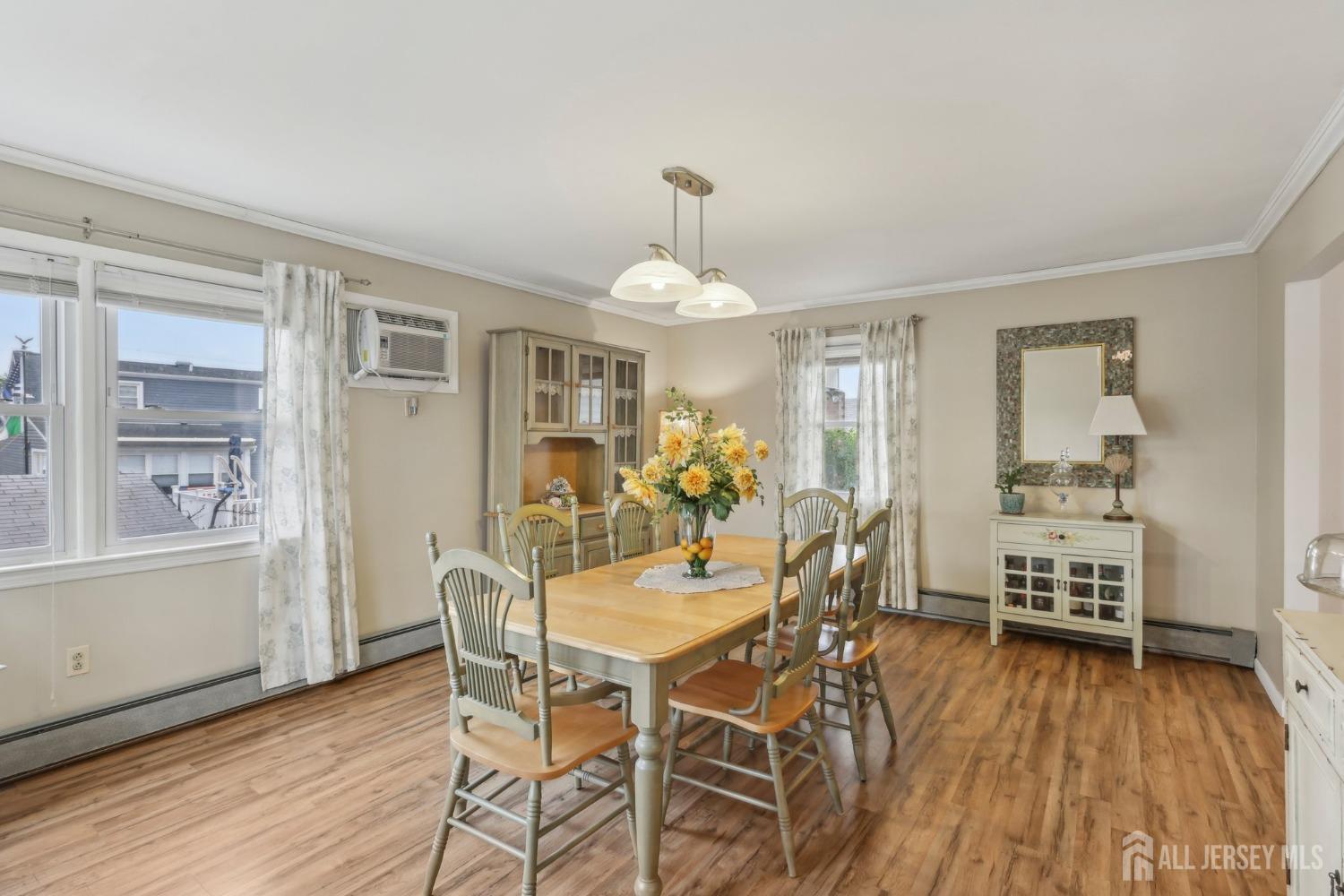 153 East Hill Road Colonia, NJ 07067 - Photo 5 of 40 a view of a dining room with furniture window and wooden floor
