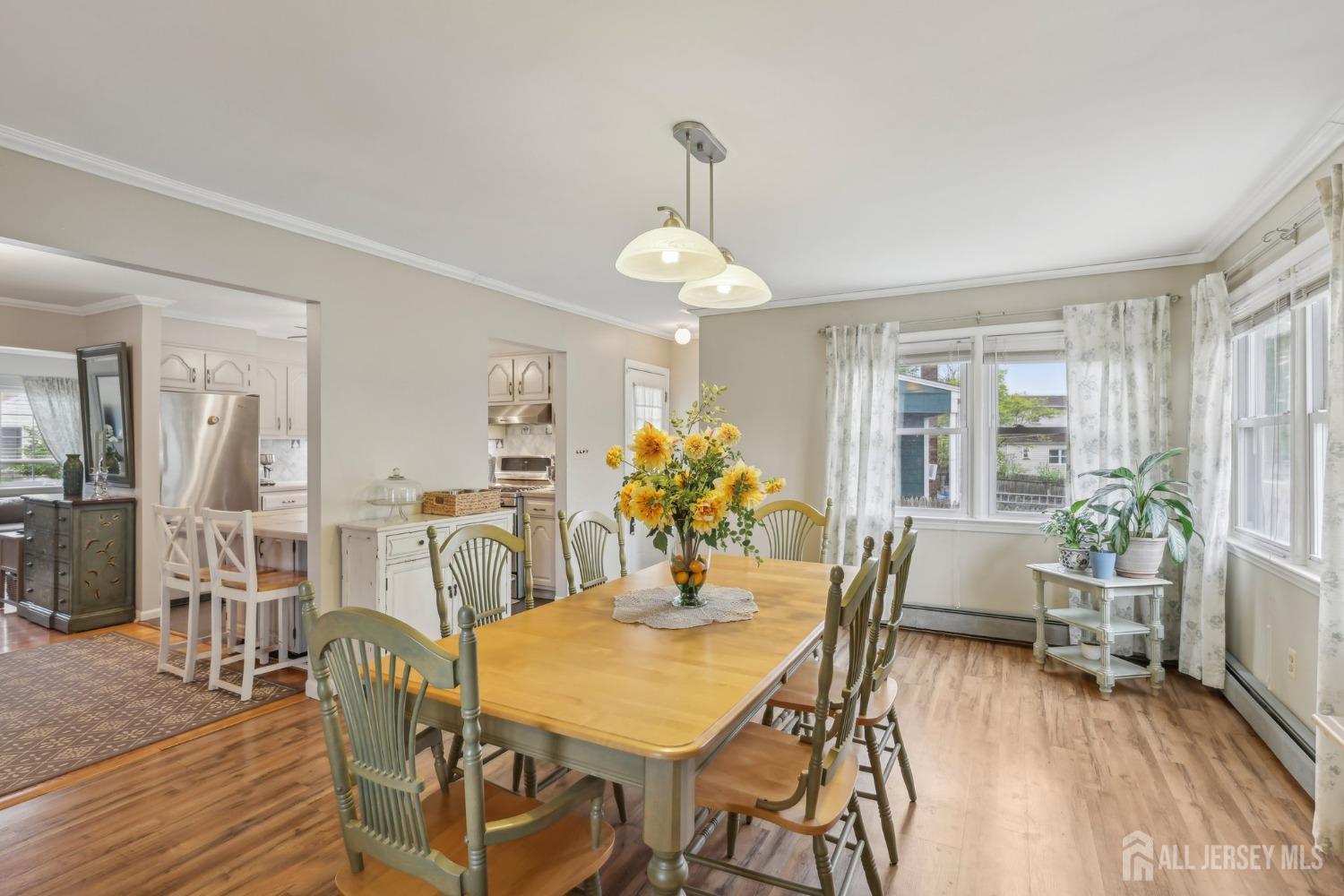 153 East Hill Road Colonia, NJ 07067 - Photo 6 of 40 a view of a dining room with furniture and wooden floor