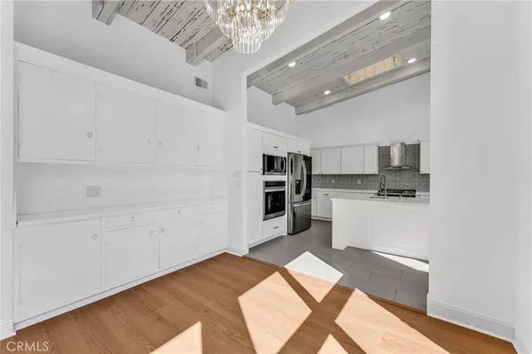 a kitchen with stainless steel appliances granite countertop a stove and a sink