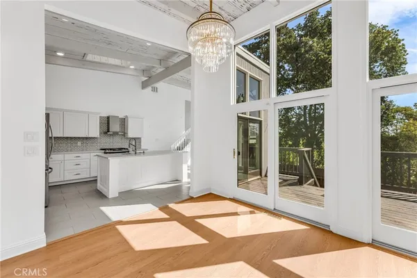 a kitchen with stainless steel appliances granite countertop a sink and a stove