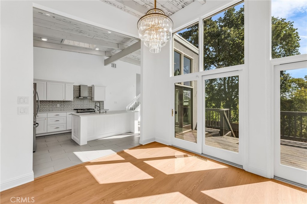 1536 Pleasant Hill Road Lafayette, CA 94549 - Photo 18 of 72 a room with stainless steel appliances kitchen island granite countertop a refrigerator a stove a sink and white cabinets with wooden floor
