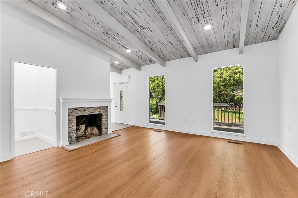 1536 Pleasant Hill Road Lafayette, CA 94549 - Photo 28 of 72 a view of an empty room with wooden floor fireplace and a window