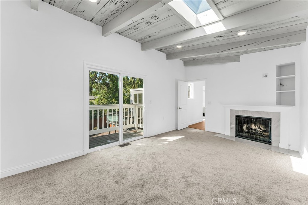1536 Pleasant Hill Road Lafayette, CA 94549 - Photo 35 of 72 a view of an empty room with a fireplace and a window