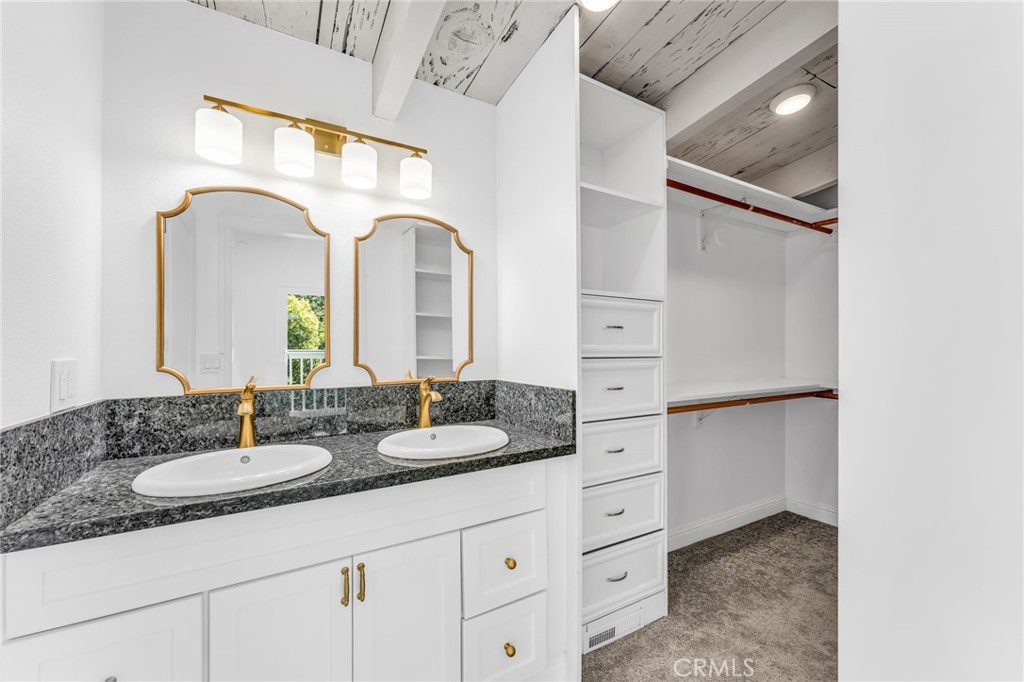 1536 Pleasant Hill Road Lafayette, CA 94549 - Photo 36 of 72 a bathroom with a granite countertop sink and a mirror