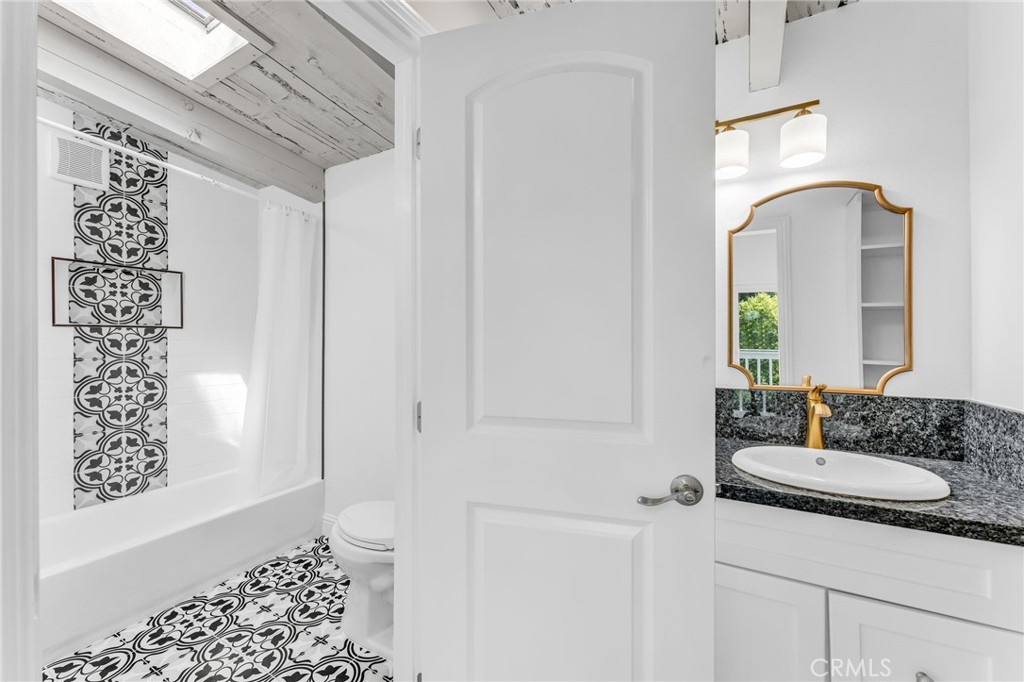 1536 Pleasant Hill Road Lafayette, CA 94549 - Photo 38 of 72 a bathroom with a granite countertop sink a toilet and shower