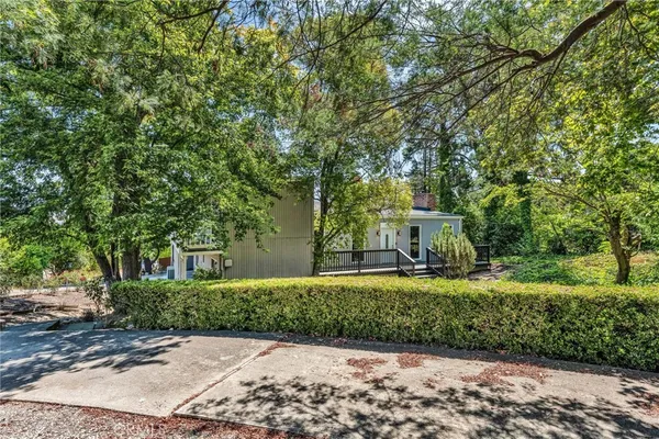 a backyard of a house with table and chairs