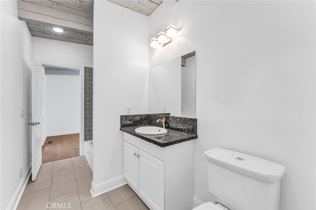 1536 Pleasant Hill Road Lafayette, CA 94549 - Photo 47 of 72 a bathroom with a granite countertop sink and a toilet