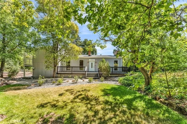 a view of a backyard of the house