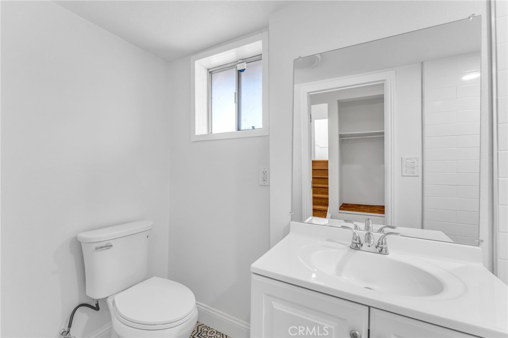 1536 Pleasant Hill Road Lafayette, CA 94549 - Photo 51 of 72 a bathroom with a sink toilet and mirror