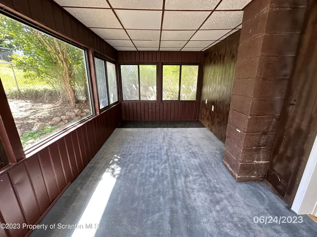 a view of hallway with a large window