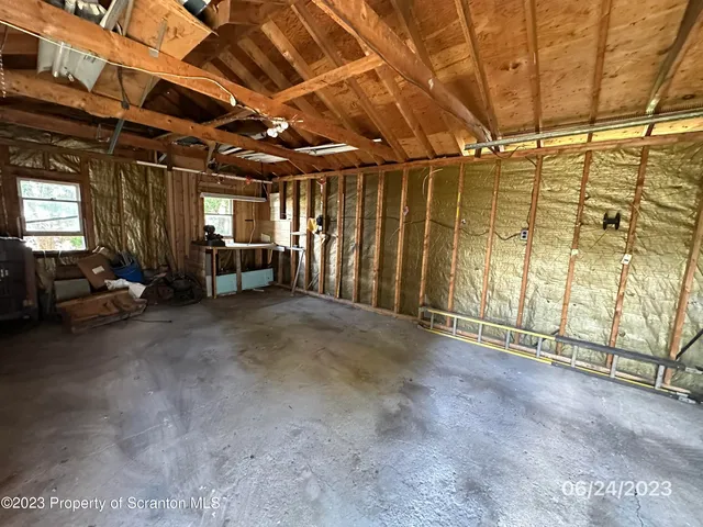 a view of an empty room with a couch
