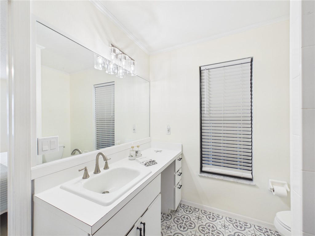 225 Midvale Terrace Sebastian, FL 32958 - Photo 18 of 25 a bathroom with a sink and a mirror