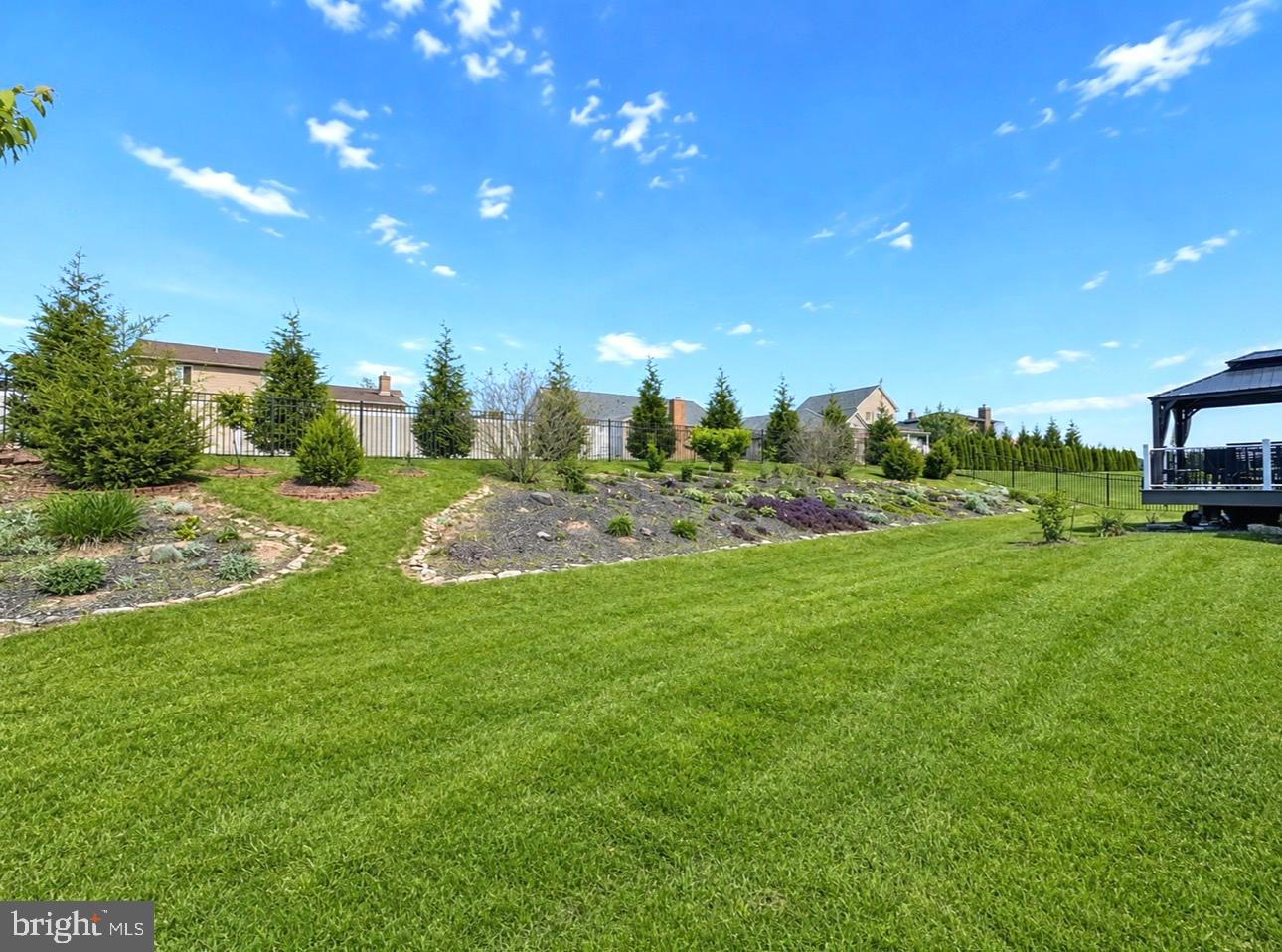 2309 Palomino Road Dover, PA 17315 - Photo 7 of 7 a view of a house with a backyard and a garden