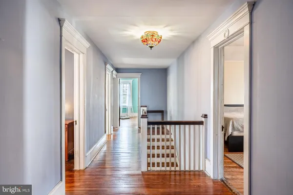a view of entryway with wooden floor