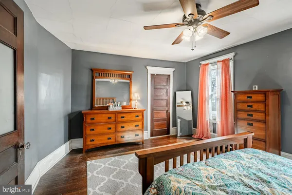 a bedroom with furniture and a window