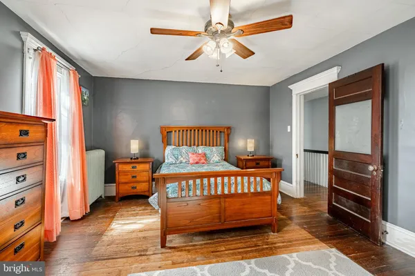 a bedroom with furniture and a window