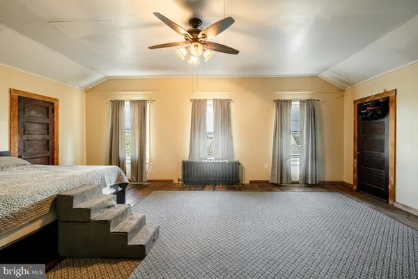 a bedroom with furniture and a chandelier