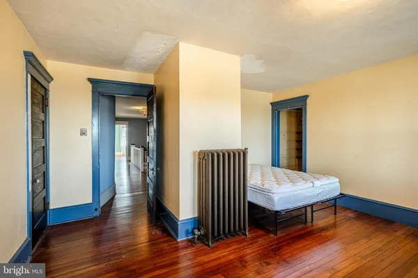 a view of a room with wooden floor and wooden floor